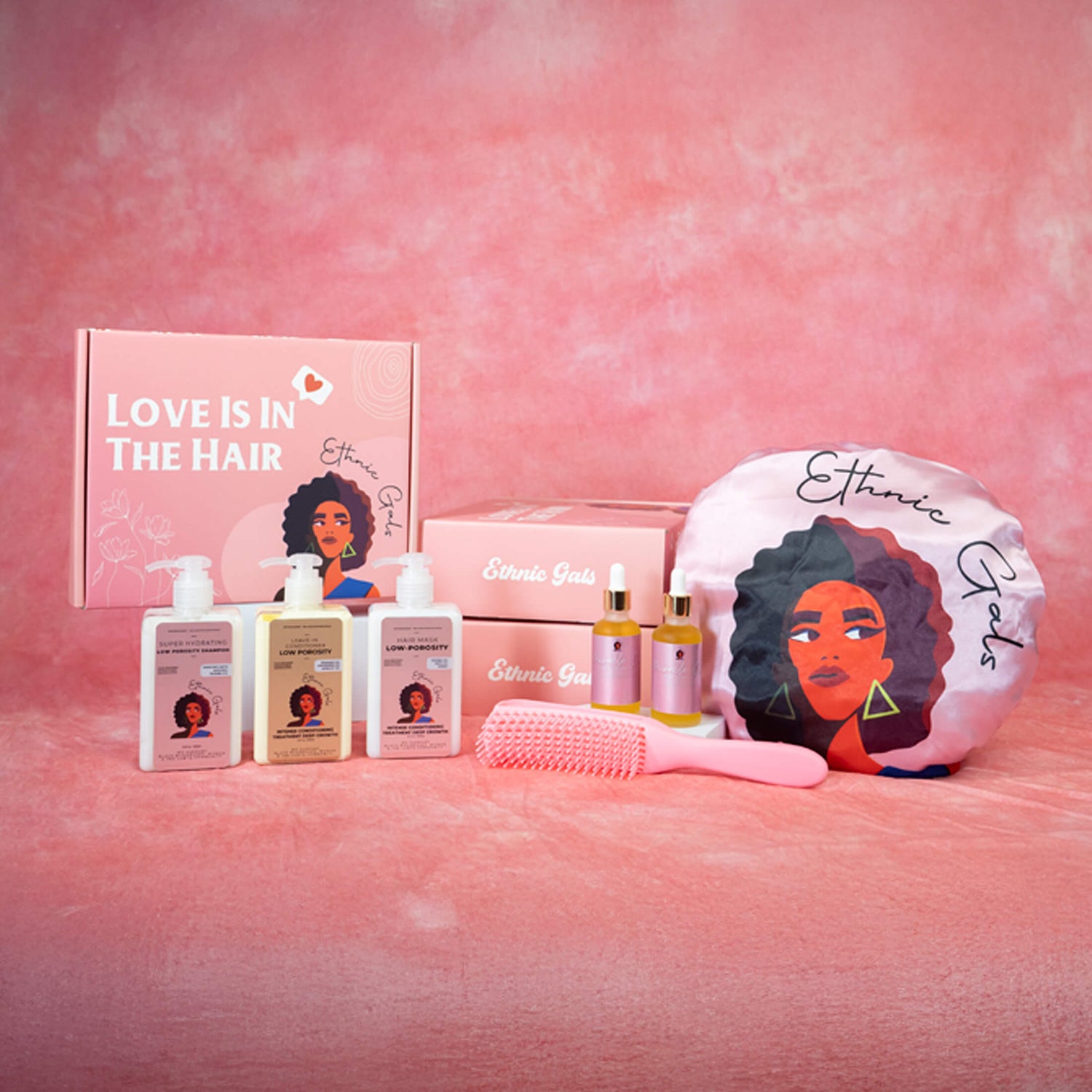 Hair care products and accessories with 'Ethnic Girls' branding on a pink background